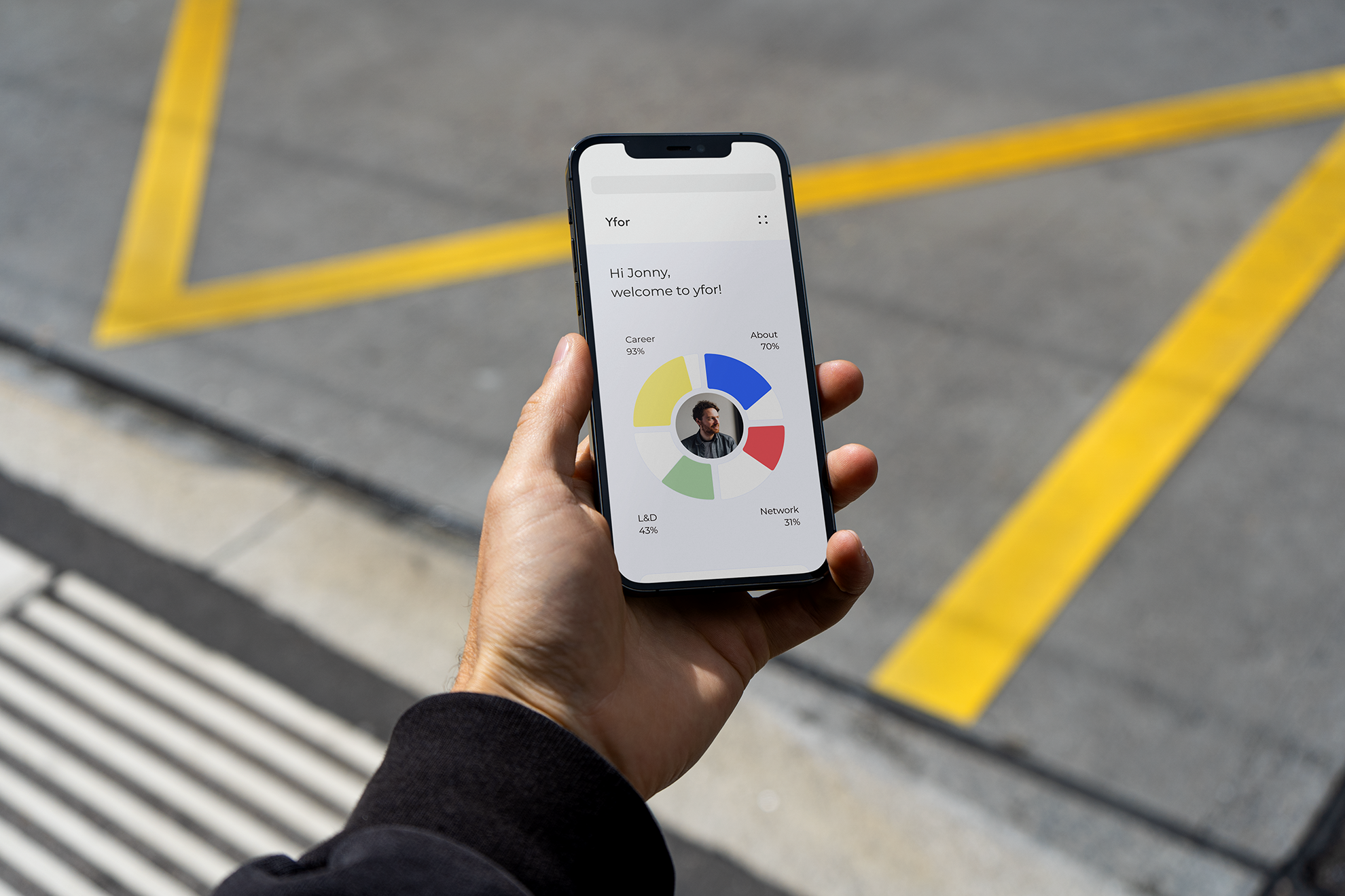 Apprentice using yfor on their phone at a construction site